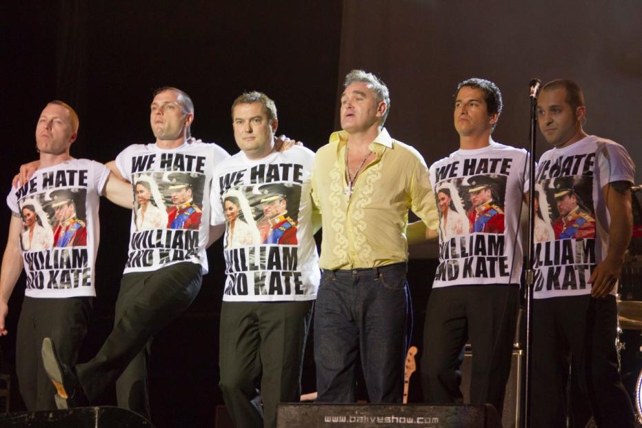 Members of British singer Morrissey band onstage wearing 'We Hate William and Kate' T-shirts, during a recital in Buenos Aires