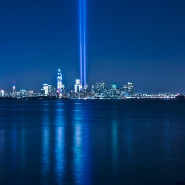 The New York City skyline with the new World Trade Center under construction. The annual Tribute In Lights display honors the memory of the attack on 